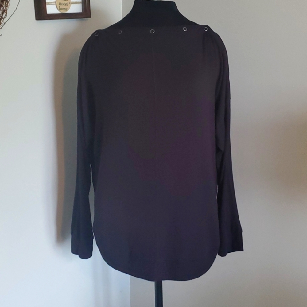 Maurices pullover with snap button shoulders.